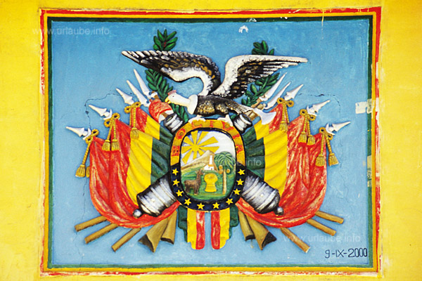 The colourful emblem hanging above the entrance door of the school