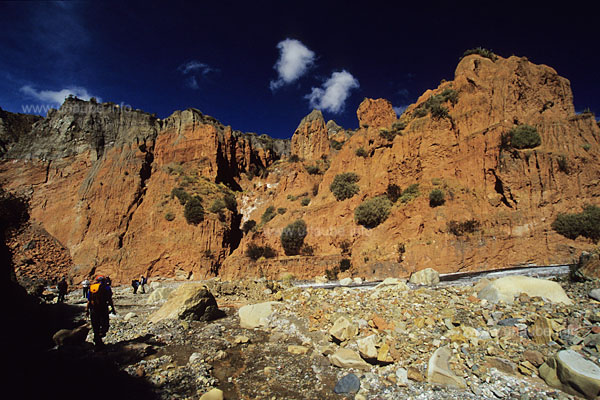 At the beginning of the canyon with red sandstone walls