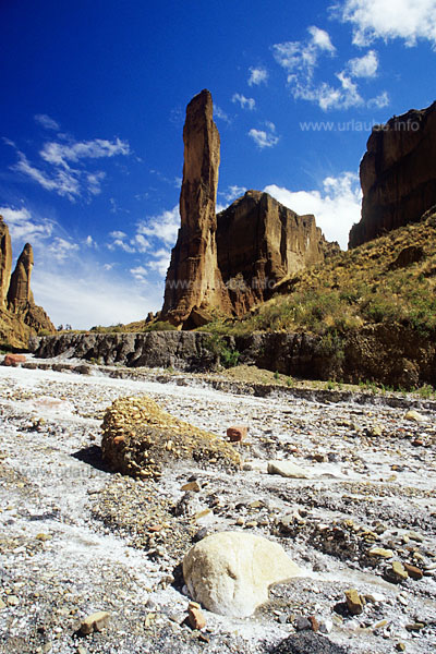 A spectacular rock tower rises from the canyon apparently up to the sky
