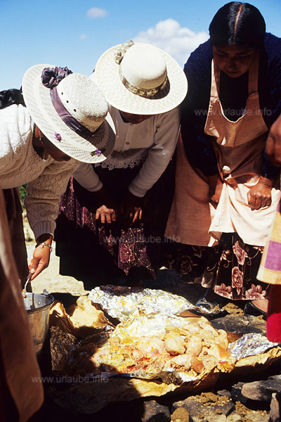 The huatia, a traditional cooking method in which the food is cooked in an earth hole.