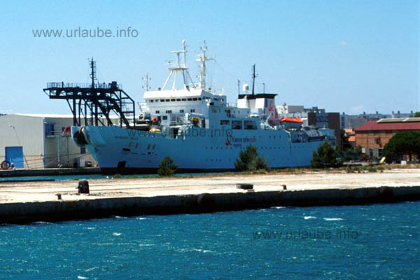 A cable ship that sinks telephone lines into the ocean