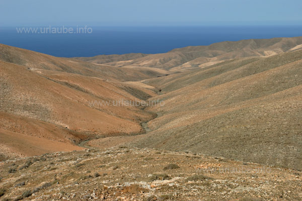 View to the eroded mountain hill in the west of the island