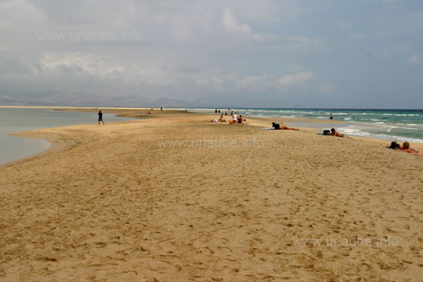 At the right of the spit there is the sea, the shallow lagoon at the left