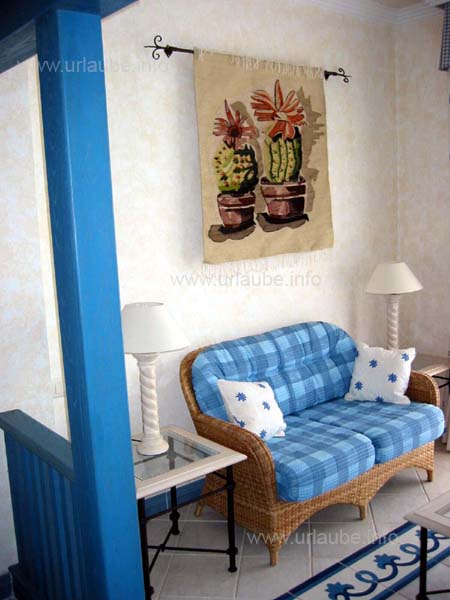 A longue with a couch and two arm chairs were also in the room