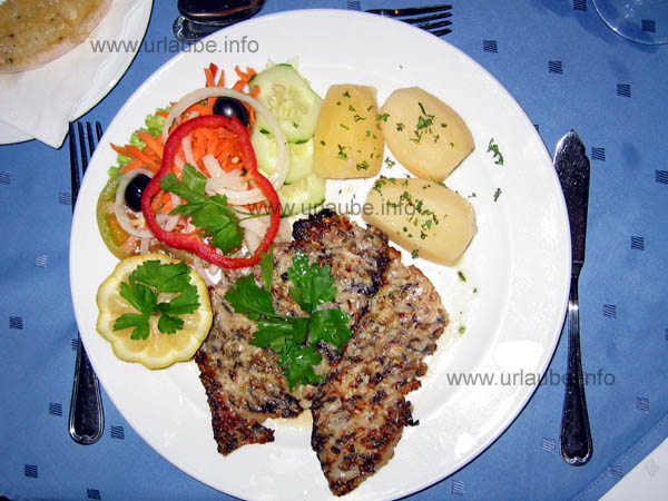 A roasted parrotfish filet, a speciality of the island
