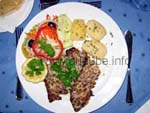 A roasted parrotfish filet, a speciality of the island