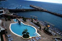 The pool area and the sea bathing area behind it; the most beautiful deck chairs are right at the sea.