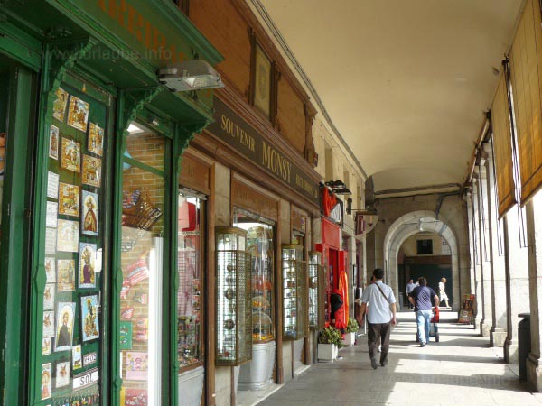 Under the archways there are a lot of shops