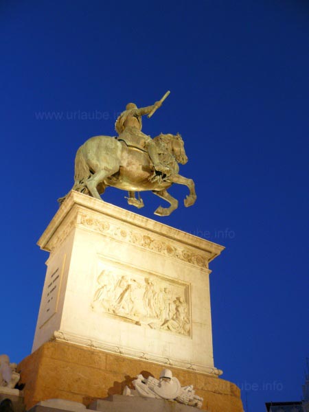 The illuminated horseman statue at night