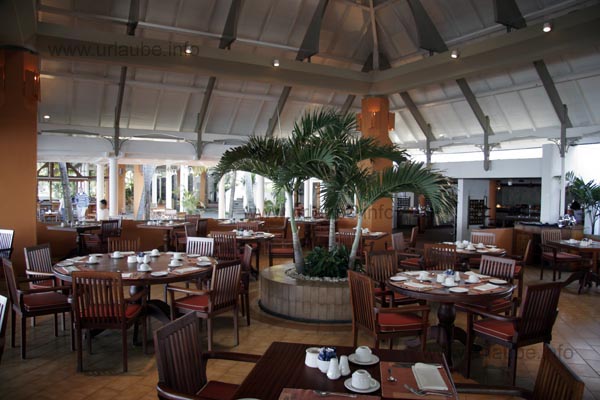 Some tables readily set for breakfast