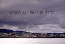 Punctually as usual at 12 o' clock, the Hurtigrute to northern direction leaves the harbour of Trondheim.