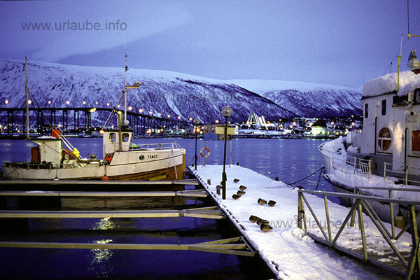 Hibernal port idyll in Troms&ouml; with the kyle bridge and the Arctic Sea Cathedral