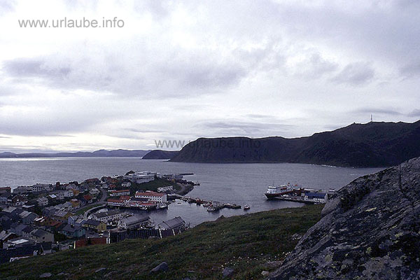 From the hill over Honningsvag, the view to the south-eastern course of the coast of the North Cape island Mager&ouml;y. At the left of the picture, at the horizon and further in the south, there is the mainland with the peninsula Porsanger. There, the submarine tunnel with a length of 8,6 km begins, that communicates Mager&ouml;y with the mainland since 1999.