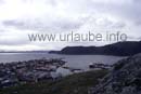 From the hill over Honningsvag, the view to the south-eastern course of the coast of the North Cape island Mageröy. At the left of the picture, at the horizon and further in the south, there is the mainland with the peninsula Porsanger. There, the submarine tunnel with a length of 8,6 km begins, that communicates Mageröy with the mainland since 1999.