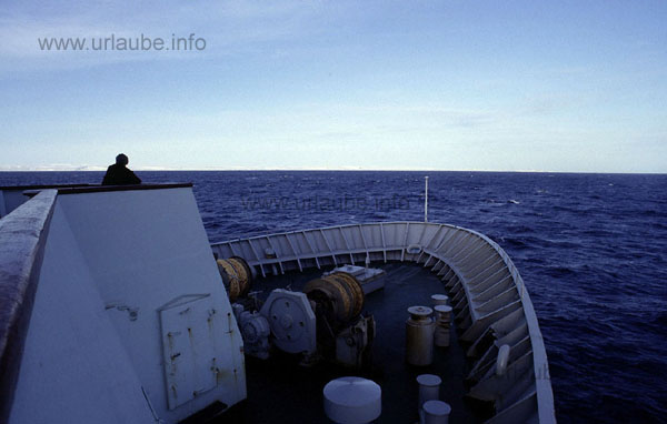 On the way from Kirkenes to Vard&ouml;. In the estuary of the Varangerfjorde, the fast steamer remains distant to the coast.