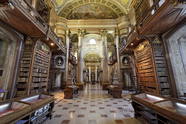 In the ceremonial room, on stands in front of a giant coulisse of galleries and wonderful ceiling frescos.