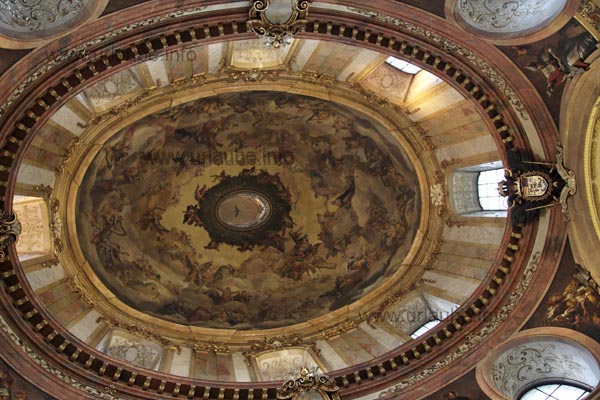 The cuppola of the St. Peter's Church is interstratified with windows and adorned with a laborious fresco