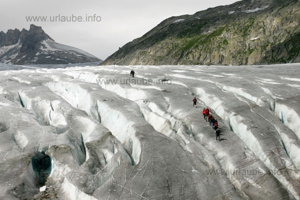 Brave glacier hikers at the bottom of the Rhone-Glacier